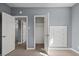 A bedroom with gray walls and wood flooring and a built-in storage unit at 352 Cox Ave, Overton, NV 89040