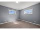 An empty bedroom with freshly painted gray walls and modern light-colored flooring at 352 Cox Ave, Overton, NV 89040
