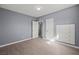 This bedroom features gray walls, light wood floors, and a built-in storage unit at 352 Cox Ave, Overton, NV 89040
