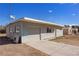 A single-story home with chain link fencing and a garage at 352 Cox Ave, Overton, NV 89040