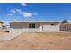 A single-story home with chain link fencing, simple design, and a low maintenance yard at 352 Cox Ave, Overton, NV 89040