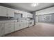 Bright kitchen with white cabinets, modern appliances, and durable wood-look floors at 352 Cox Ave, Overton, NV 89040