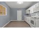 Bright kitchen with white cabinets, modern appliances, and durable wood-look floors at 352 Cox Ave, Overton, NV 89040