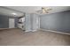 Living room showcases modern, gray walls, wood-look floors, and a view of the kitchen at 352 Cox Ave, Overton, NV 89040