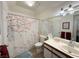 Bathroom showcasing a stylish floral shower curtain, vanity, and ample lighting for a bright ambiance at 3550 Bay Sands Dr # 1101, Laughlin, NV 89029