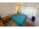 Bedroom featuring hard surface flooring with double closet and lamps at 3550 Bay Sands Dr # 1101, Laughlin, NV 89029
