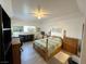 Comfortable bedroom featuring light wood floors, ceiling fan, and a window offering natural light at 3550 Bay Sands Dr # 1101, Laughlin, NV 89029