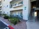 Building exterior with a patio, outdoor seating, and staircase access, surrounded by well-maintained landscaping at 3550 Bay Sands Dr # 1101, Laughlin, NV 89029