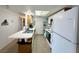 Cozy kitchen with white cabinets, tile floors and modern appliances at 3550 Bay Sands Dr # 1101, Laughlin, NV 89029