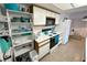 Bright kitchen featuring white appliances and cabinets, with a skylight and tile floor at 3550 Bay Sands Dr # 1101, Laughlin, NV 89029