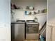 Practical laundry closet with a modern washer and dryer set and shelving for storage solutions at 3550 Bay Sands Dr # 1101, Laughlin, NV 89029