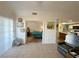 The open-concept living room flows to the bedroom and kitchen, featuring neutral colors and a tile floor at 3550 Bay Sands Dr # 1101, Laughlin, NV 89029