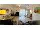 The spacious living room is well-lit, featuring neutral colors, tile floors, a ceiling fan, and easy balcony access at 3550 Bay Sands Dr # 1101, Laughlin, NV 89029