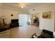 Inviting living room featuring tile flooring, a ceiling fan, sliding door to a balcony, and neutral decor at 3550 Bay Sands Dr # 1101, Laughlin, NV 89029