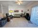 Living room with tile flooring, neutral paint, ceiling fan, slider to balcony, and comfortable furnishings at 3550 Bay Sands Dr # 1101, Laughlin, NV 89029