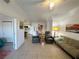 Open concept living room with tile floor, slider to the balcony, neutral colors, and easy access to the kitchen at 3550 Bay Sands Dr # 1101, Laughlin, NV 89029