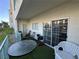 Cozy patio features a glass-top table, comfortable seating, and sliding glass doors for indoor-outdoor living at 3550 Bay Sands Dr # 1101, Laughlin, NV 89029