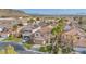 An aerial view of a home featuring lush landscaping, a manicured lawn, and a two-car garage at 3728 Russell Peterson Ct, Las Vegas, NV 89129