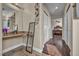 Bathroom featuring dual sinks, granite counters, and a bright vanity area at 3728 Russell Peterson Ct, Las Vegas, NV 89129
