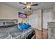 Comfortable bedroom with dark bedding and a large stuffed animal at 3728 Russell Peterson Ct, Las Vegas, NV 89129