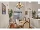 Formal dining room with natural light, elegant chandelier, and space for entertaining at 3728 Russell Peterson Ct, Las Vegas, NV 89129
