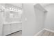 Bathroom with walk-in closet, dual vanity and modern sinks at 3944 Visby Ln, Las Vegas, NV 89119
