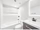 Bathroom featuring vanity with sleek countertop and cabinet, toilet, and shower-tub combo at 3944 Visby Ln, Las Vegas, NV 89119