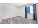 Bedroom with wood-look floors, window and neutral color scheme for versatile decor at 3944 Visby Ln, Las Vegas, NV 89119