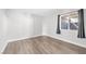 Minimalist bedroom with modern flooring, a window, and a clean, uncluttered look at 3944 Visby Ln, Las Vegas, NV 89119