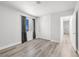 Bright bedroom with wood-look floors, window and closet with sliding doors at 3944 Visby Ln, Las Vegas, NV 89119