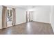 Bright bedroom with wood-look flooring and large windows providing ample natural light at 3944 Visby Ln, Las Vegas, NV 89119