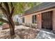 Charming home exterior featuring desert landscaping, a security door, and a brick-paved entrance at 3944 Visby Ln, Las Vegas, NV 89119