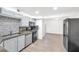 Well-lit kitchen featuring modern stainless steel appliances and sleek countertops at 3944 Visby Ln, Las Vegas, NV 89119