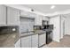Bright kitchen with modern appliances, neutral gray cabinets, and stylish backsplash at 3944 Visby Ln, Las Vegas, NV 89119