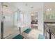 Well-lit bathroom showcasing a glass-enclosed shower, soaking tub, and a vanity with granite countertops at 3981 E Teller Dr, Pahrump, NV 89061