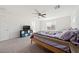 Primary bedroom with ceiling fan and large windows providing ample natural light at 3981 E Teller Dr, Pahrump, NV 89061