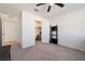 Bedroom with ceiling fan, walk-in closet, carpet floors, and ensuite bathroom at 3981 E Teller Dr, Pahrump, NV 89061