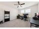 Bedroom with a ceiling fan, carpet floors, and a desk area perfect for a home office at 3981 E Teller Dr, Pahrump, NV 89061