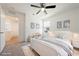 Neutral bedroom with soft lighting, comfortable bedding, and a ceiling fan at 3981 E Teller Dr, Pahrump, NV 89061