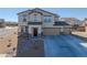 Beautiful two-story home featuring a three car garage and landscaped front yard at 3981 E Teller Dr, Pahrump, NV 89061