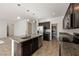 Modern kitchen featuring a center island with a sink, stainless steel appliances, and pantry at 3981 E Teller Dr, Pahrump, NV 89061