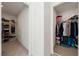 View of dual walk-in closets featuring built-in clothing organizers and carpet flooring at 3981 E Teller Dr, Pahrump, NV 89061