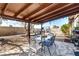 Backyard patio features a covered dining area, ample seating, and manicured landscaping at 432 Bottle Brush Way, Henderson, NV 89015
