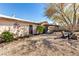 Spacious backyard with drought landscaping features a covered patio and seating area at 432 Bottle Brush Way, Henderson, NV 89015