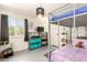 bedroom with a twin bunk bed, storage shelves, and a large window at 432 Bottle Brush Way, Henderson, NV 89015