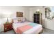 Comfortable bedroom featuring a cozy bed, side table and modern decor at 432 Bottle Brush Way, Henderson, NV 89015