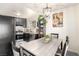 Stylish dining area with modern table setting, stainless steel appliances, and decorative plants at 432 Bottle Brush Way, Henderson, NV 89015