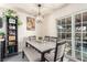 Dining room features a dining table with seating for four, sliding glass doors, and natural light at 432 Bottle Brush Way, Henderson, NV 89015