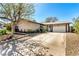 Charming single-story home featuring a well-maintained front yard and a spacious driveway leading to a two-car garage at 432 Bottle Brush Way, Henderson, NV 89015