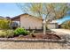 Charming home with desert landscaping, an extended driveway, and a two-car garage at 432 Bottle Brush Way, Henderson, NV 89015